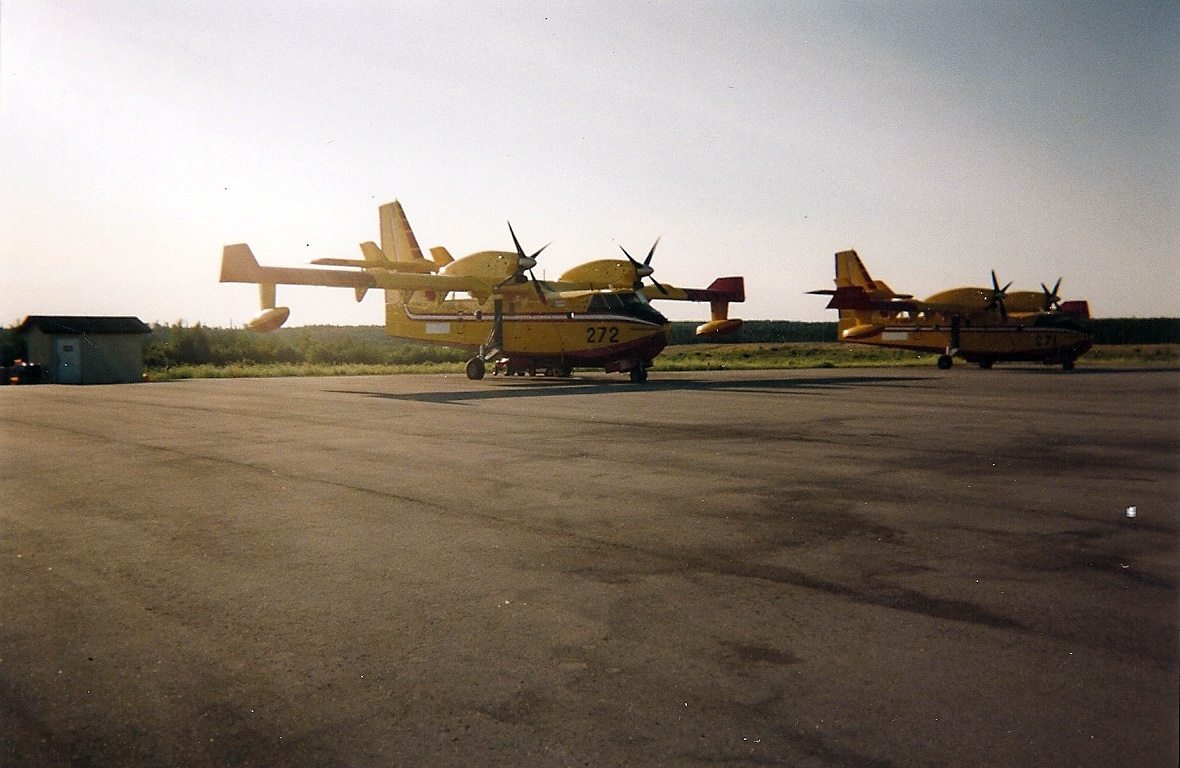 Two CL-415's waiting on the tarmac