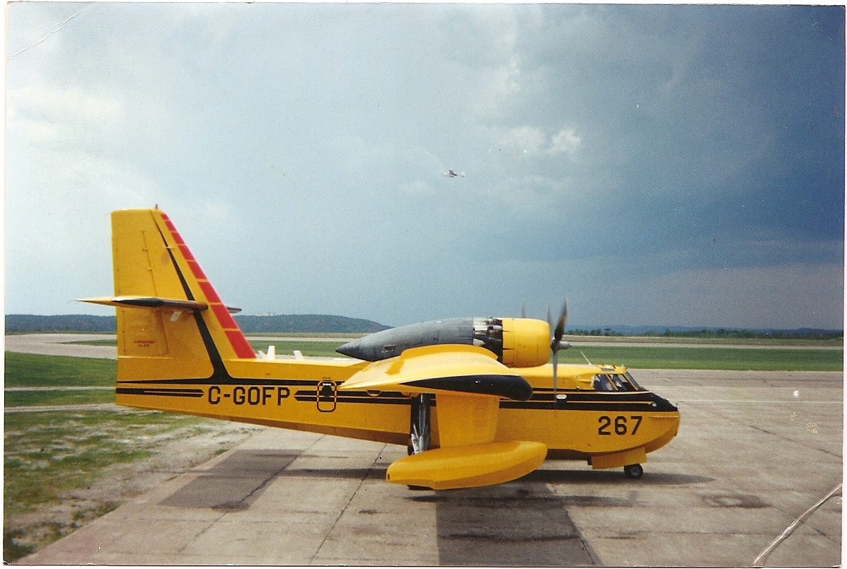 Waterbomber on the Tarmac with a lightweight spotter plane in the background